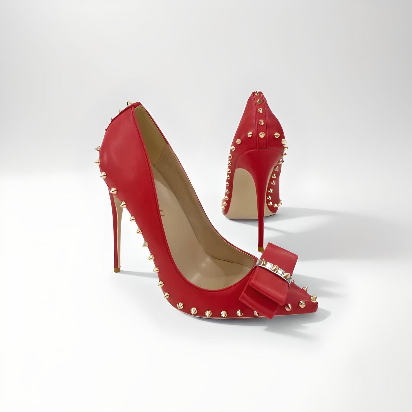 Rivet spike stiletto pumps with bow