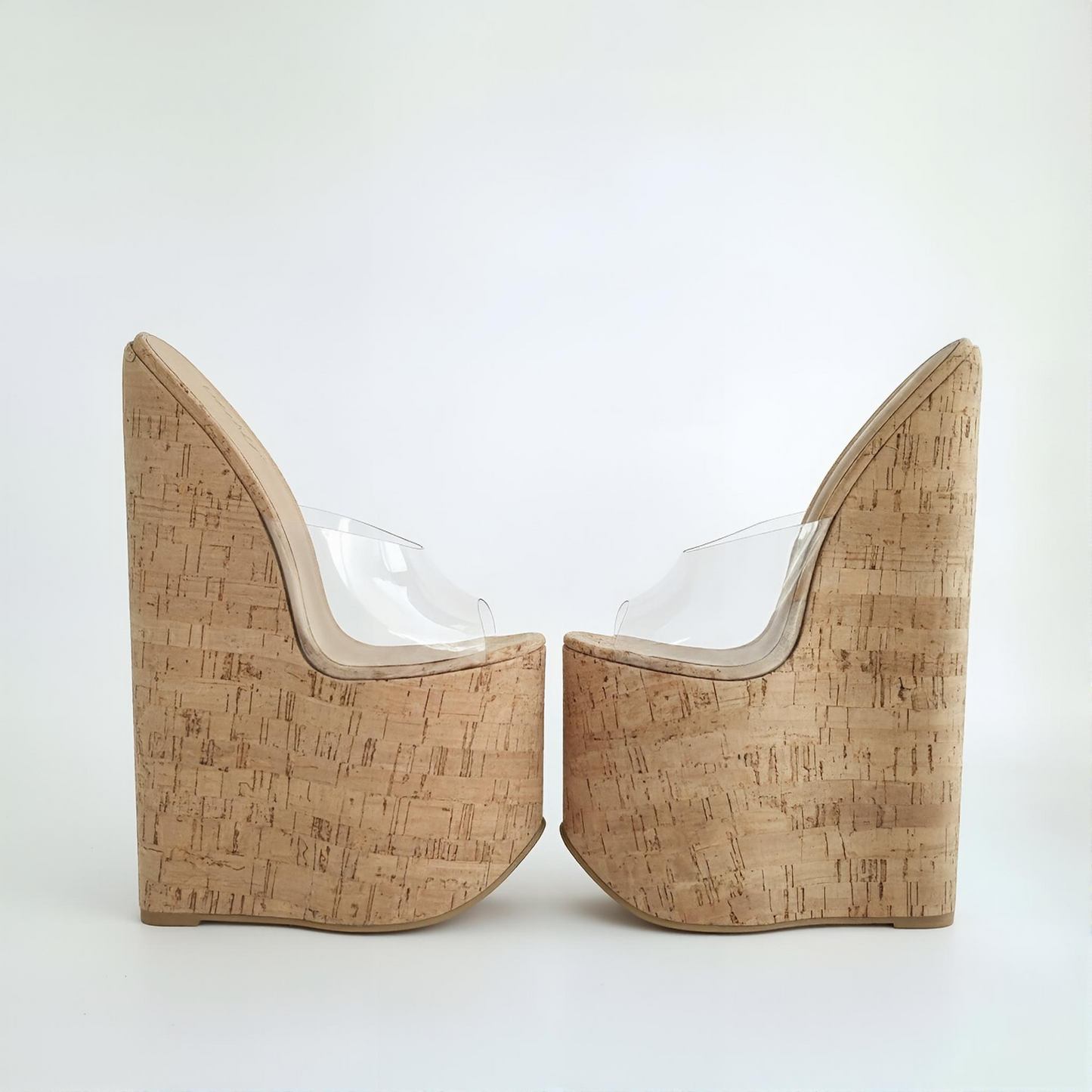 Extreme high heel cork wedge mules with clear peep toe upper