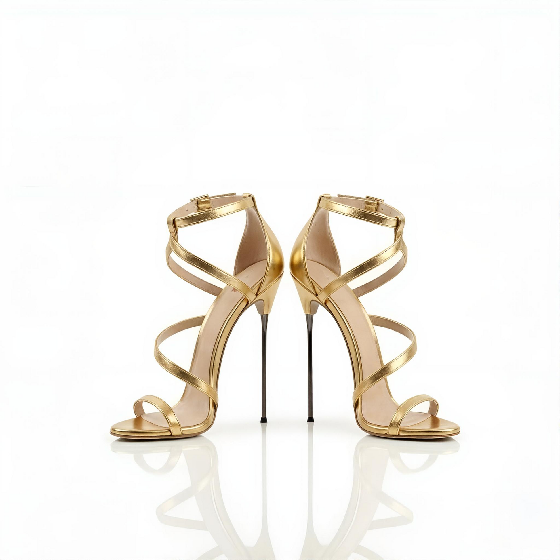 Pair of gold 16cm stiletto high-heeled sandals on a white background