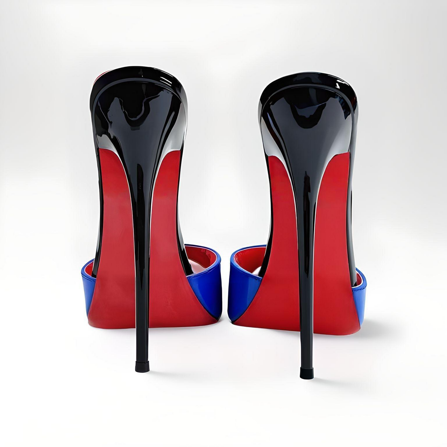 Pair of high-heeled 16cm mules with black, red, and blue design on a white background